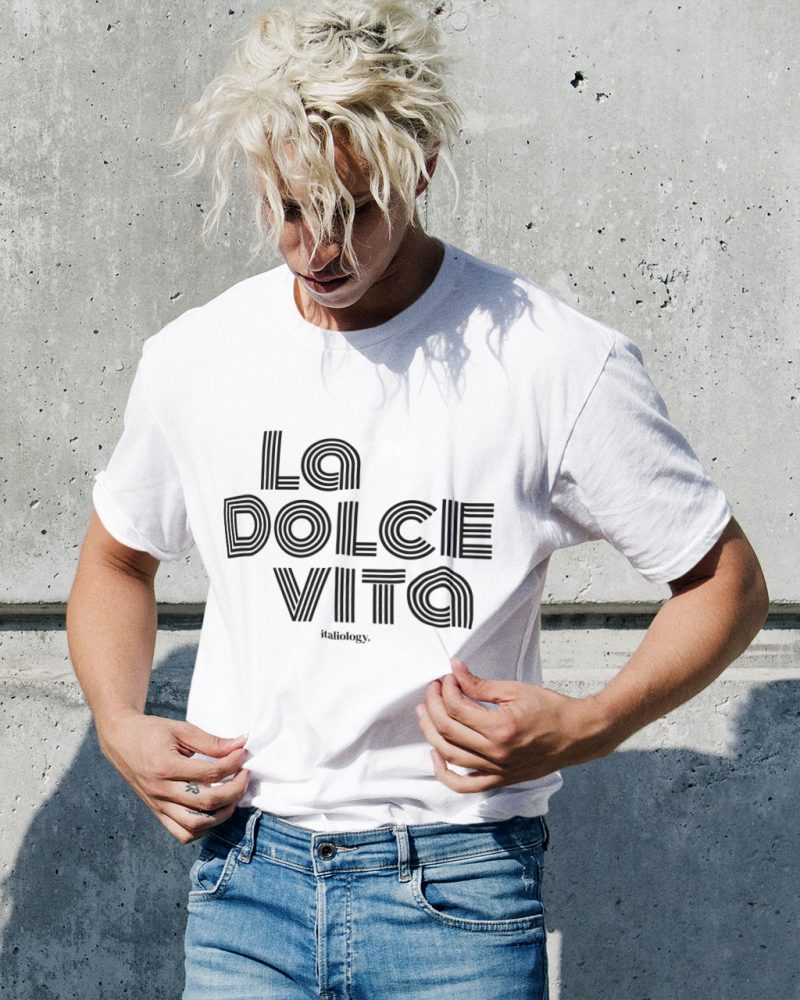 man in a white la dolce vita t-shirt