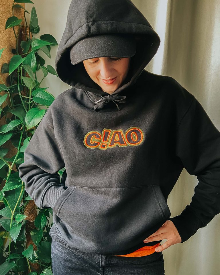 woman wearing black oversize ciao hoodie
