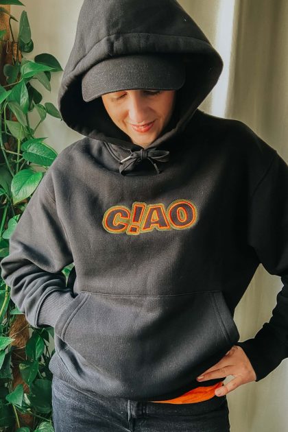 woman wearing black oversize ciao hoodie