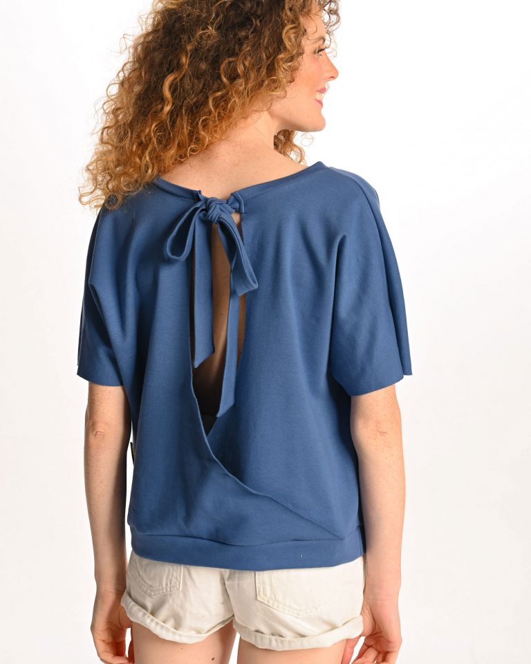 woman wearing blue tshirt with no back